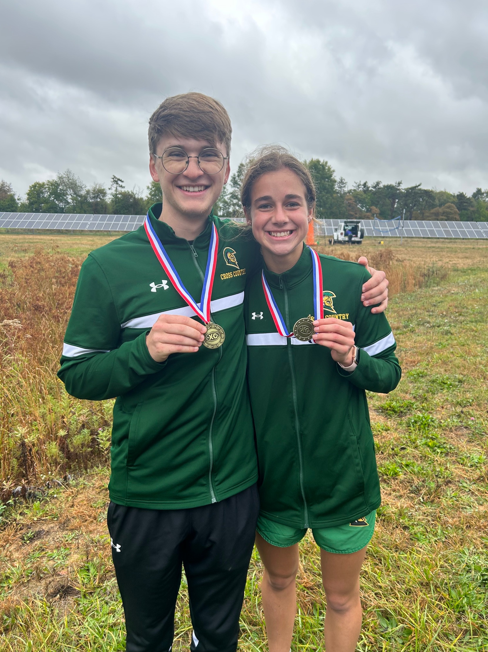 Andrew Hardy and Annette Fare holding medals at Charger Invitational.